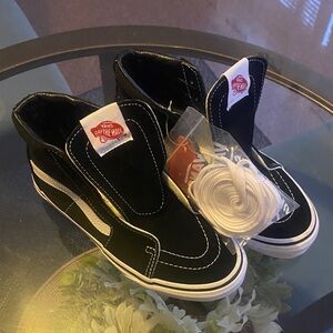 Vans Black Slip-On Sneakers with White Accents
